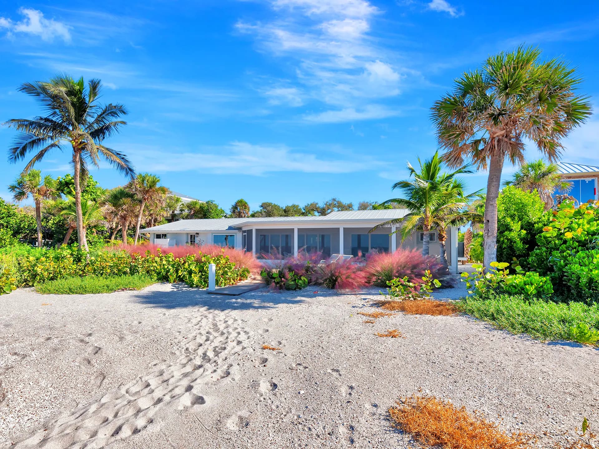 Property Exterior of a luxury residential property in Englewood, Florida. This stunning front exterior view of the luxury property, highlighting professional landscaping and custom architectural lines on the Florida Gulf Coast, captured with professional real estate media standards.