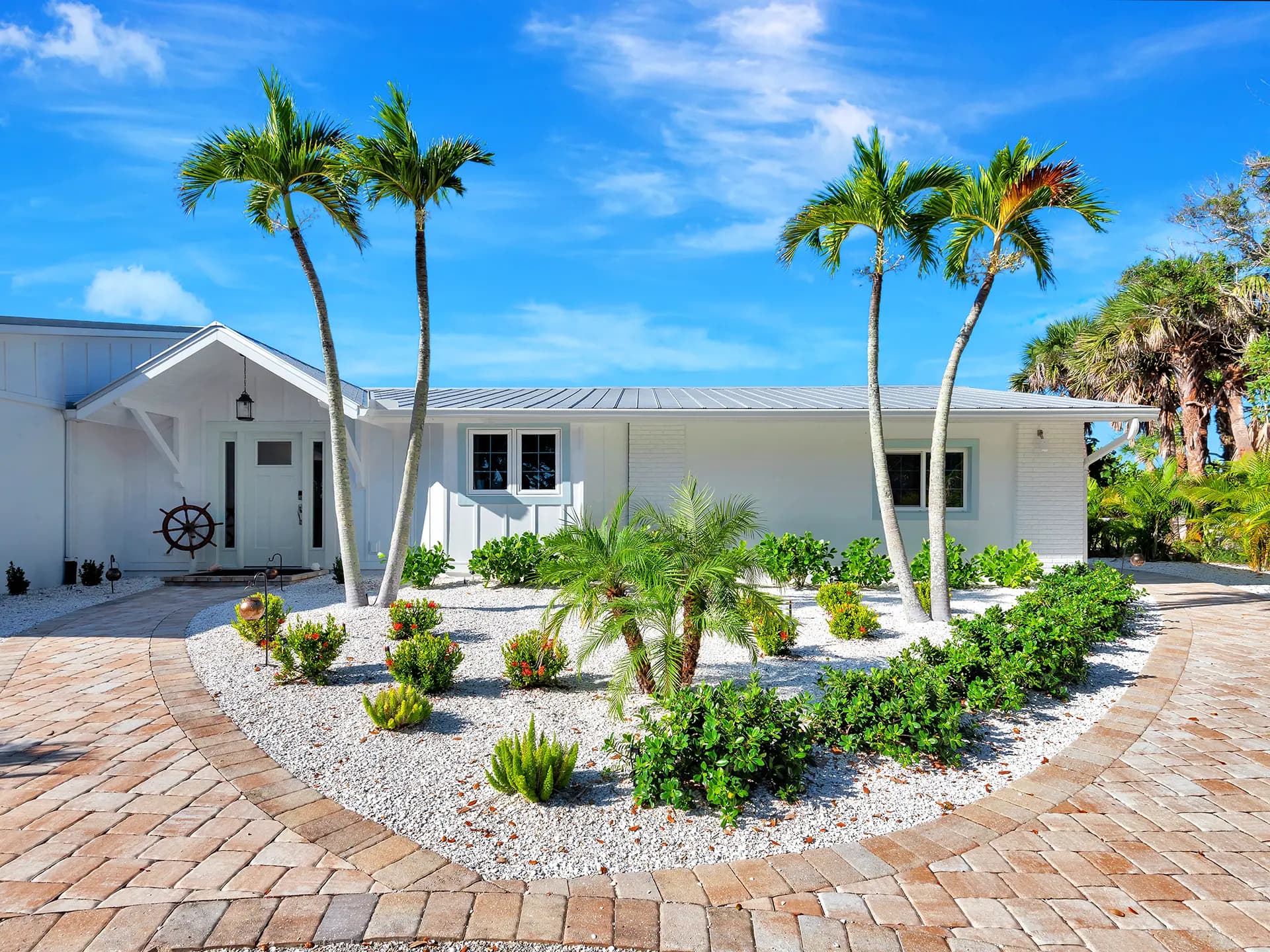 Stunning dusk front view real estate photography of an Englewood, Florida beachfront home, produced by HDR Media Pro.